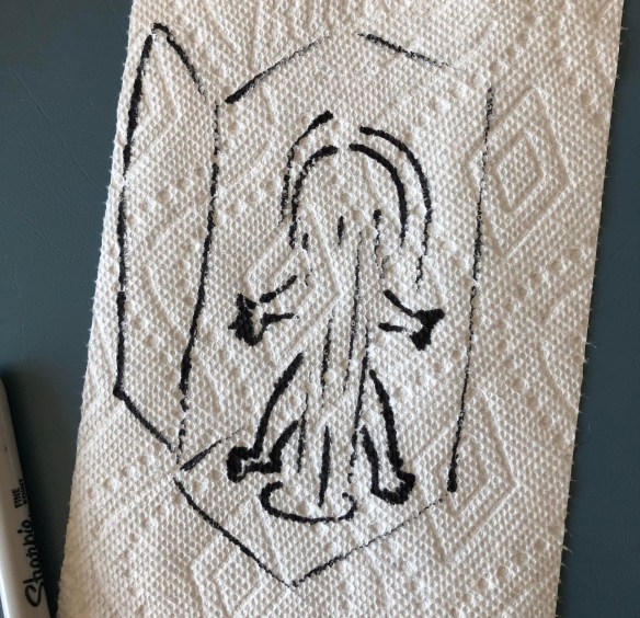 A black-marker sketch on a paper towel of a shower stall.